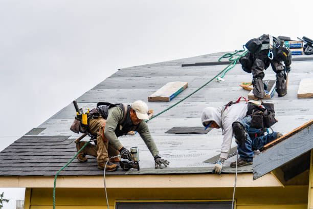 Professional Roofing technician working in Valencia, CA